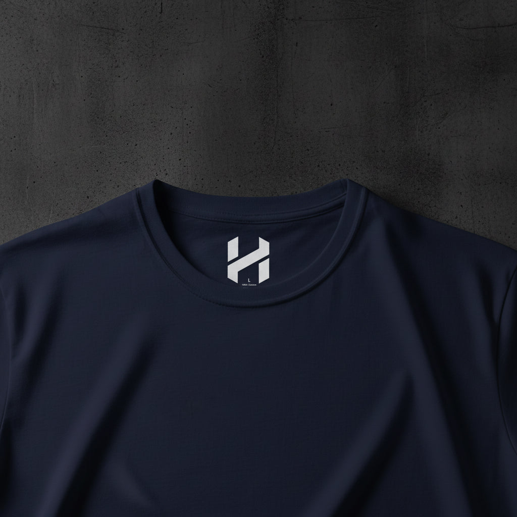 Navy blue t-shirt with a white logo on the collar against a white background