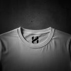 White t-shirt with a black logo on a white background