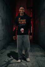 Male model wearing the 'Final Boss' Pixel Art Hoodie in a relaxed, unisex fit. The Dark Gaming Streetwear pullover features the 'GAME OVER' pixel font on the chest and a bold arcade skull graphic