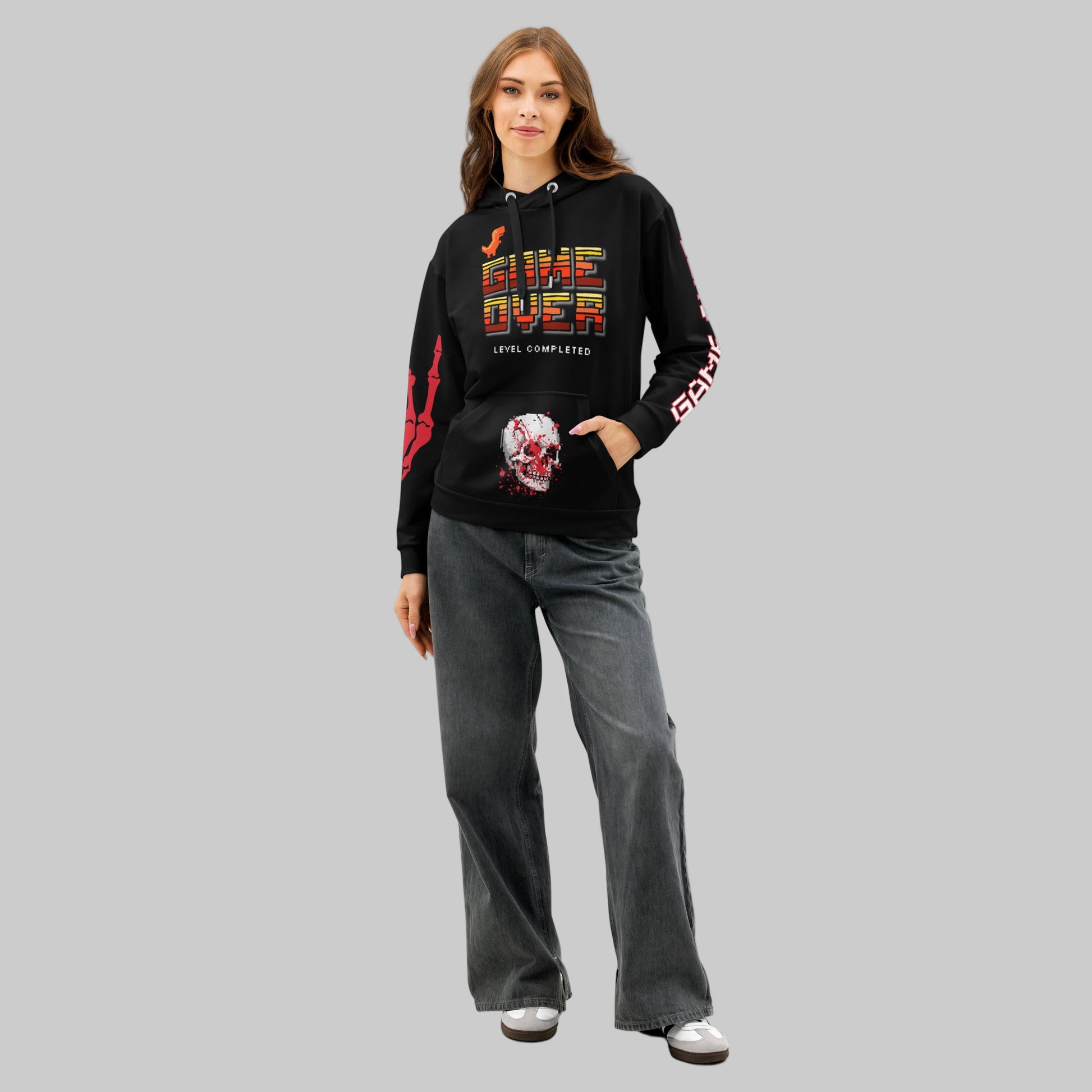 Model with hands in the spacious front pocket of the hoodie, highlighting the red skull and blood graphic detail. The image also captures the 'GAME OVER' sleeve text, reinforcing the Gothic Streetwear aesthetic.