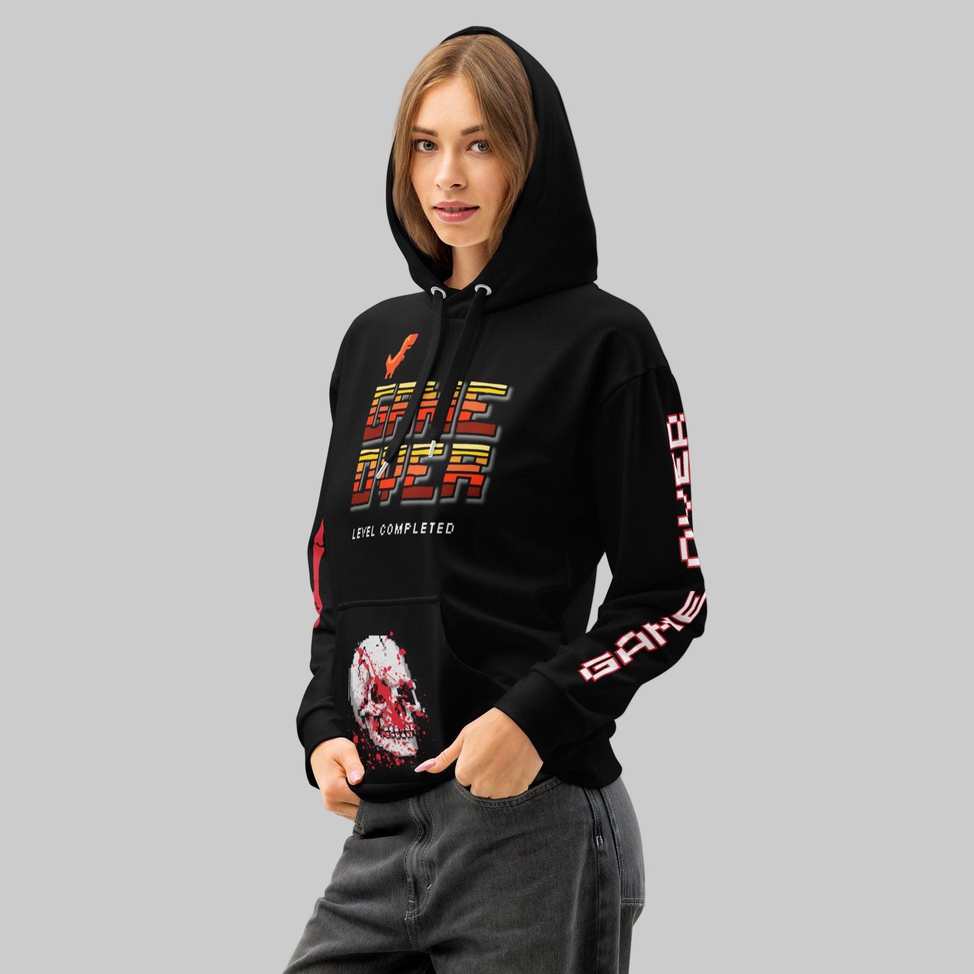 female model wearing the 'Final Boss' Pixel Art Hoodie in a relaxed, unisex fit. The Dark Gaming Streetwear pullover features the 'GAME OVER' pixel font on the chest and a bold arcade skull graphic.