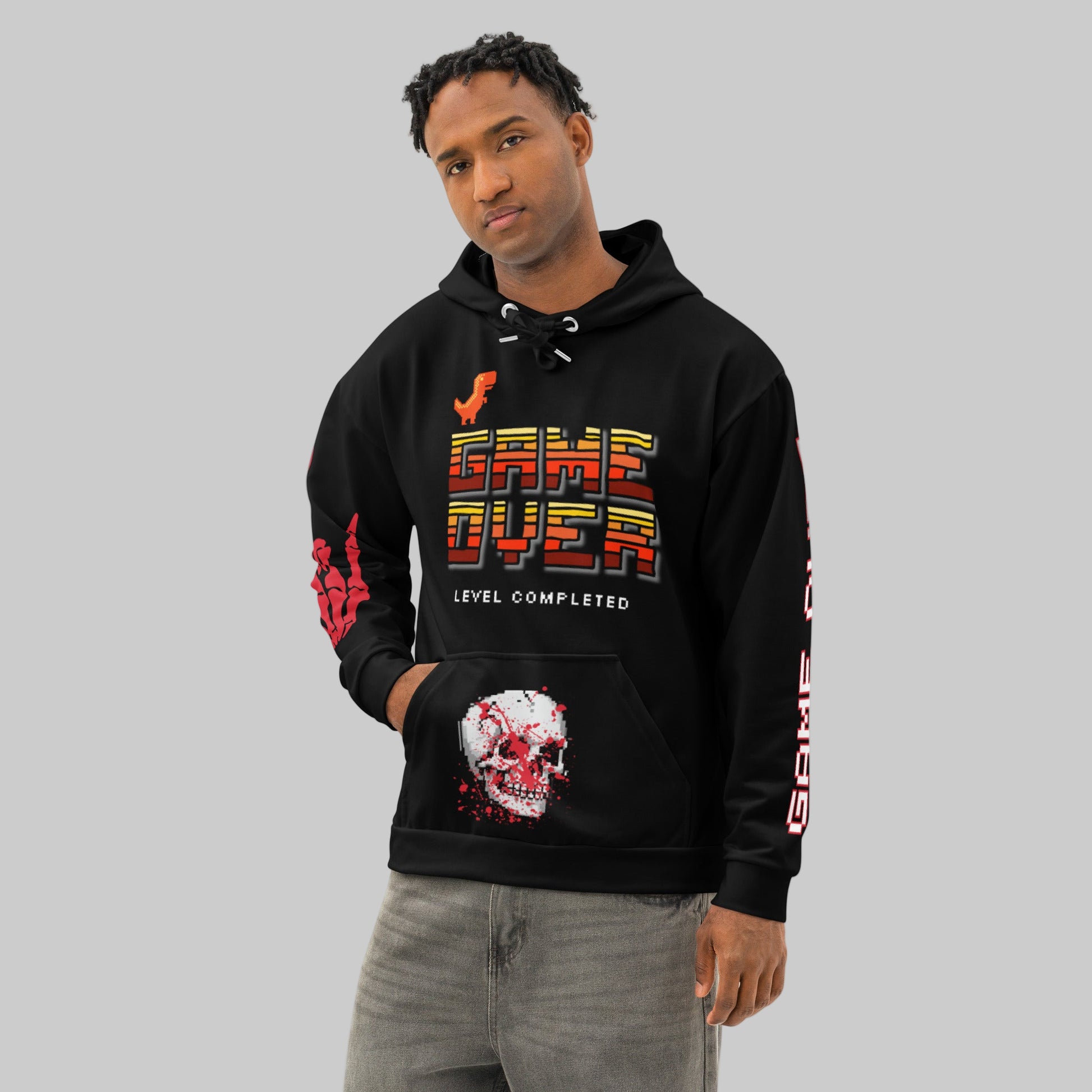 Male model wearing the 'Final Boss' Pixel Art Hoodie in a relaxed, unisex fit. The Dark Gaming Streetwear pullover features the 'GAME OVER' pixel font on the chest and a bold arcade skull graphic.