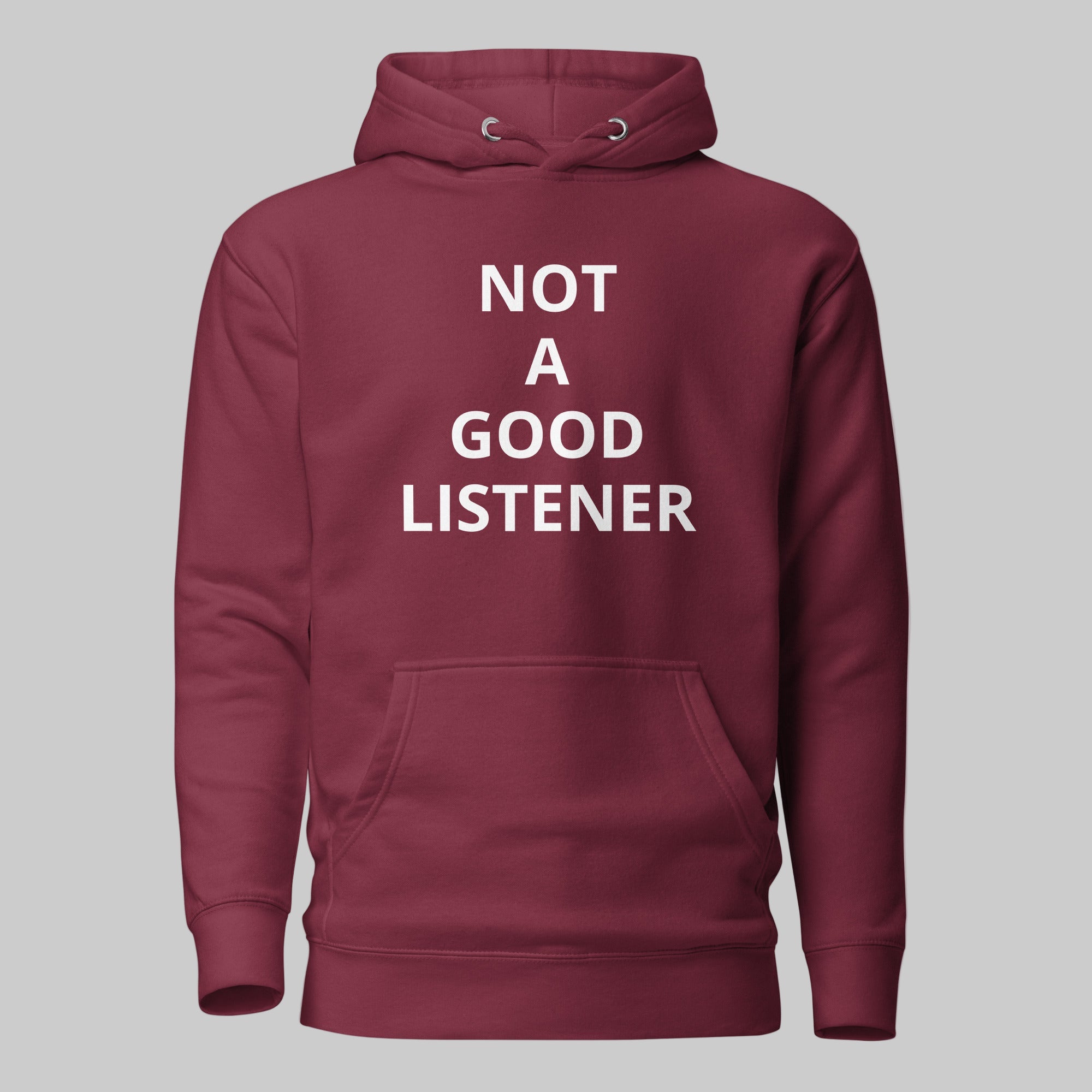 Oversized graphic hoodie in black with the white "NOT A GOOD LISTENER" text design across the chest. Premium streetwear apparel.