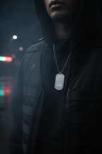 Male model wearing Hunter Crosshair Dog Tag Necklace in stainless steel silver finish, dark editorial streetwear photography