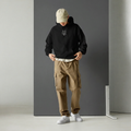 Main hoodie image with textured dark gray board